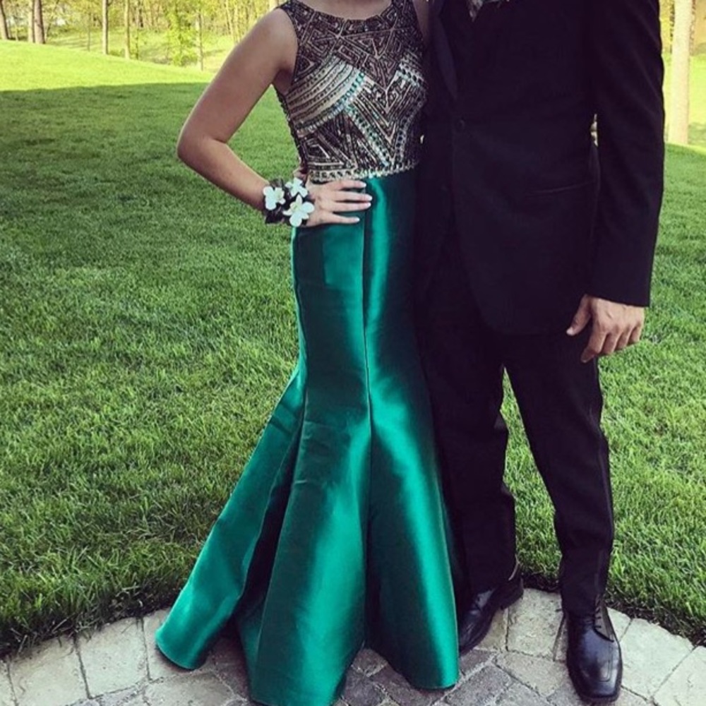 A green Camille la vie prom dress